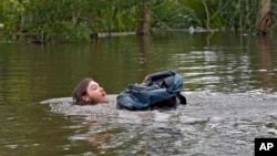 Connor Hughes moves in deep floodwaters left by Hurricane Milton along the Alafia River on Oct. 11, 2024, in Lithia, Florida.