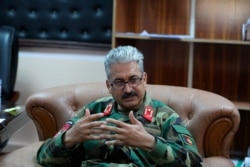 Gen. Mir Asadullah Kohistani, the new commander of Bagram Airfield, speaks during an interview with the Associated Press, after the American military departed, July 5, 2021.