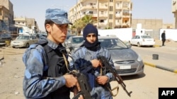 FILE - An image grab taken from a video from AFPTV, on Feb. 6, 2019, shows forces loyal to Libyan strongman Khalifa Haftar patrolling in downtown Sebha, the biggest city in southern Libya. 