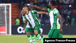 Nigeria's defender William Troost-Ekong (L) celebrates after scoring his team's second goal during the football match between Guinea-Bissau and Nigeria in Cameroon, Jan. 19, 2022.