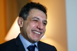 FILE - Nizar Zakka, a Lebanese citizen and permanent U.S. resident who was released in Tehran after nearly years in jail on charges of spying, smiles during an interview with AP at a hotel in Dbayeh, north of Beirut, June 12, 2019.