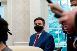 FILE - White House chief of staff Ron Klain attends a weekly economic briefing in the Oval Office of the White House, Friday, April 9, 2021, in Washington. (AP Photo/Andrew Harnik)