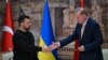 Turkish President Recep Tayyip Erdogan (R) shakes hands with Ukrainian President Volodymyr Zelensky (L) after a joint press conference at the Dolmabahce Presidental office in Istanbul on March 8, 2024. (Photo by OZAN KOSE / AFP)