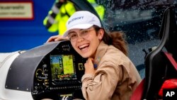 Belgium-British teenage pilot Zara Rutherford smiles after she landed with her Shark ultralight plane at the Egelsbach airport in Frankfurt, Germany, Jan.19, 2022. 