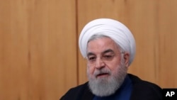 FILE - Iranian President Hassan Rouhani, pictured in Tehran, Oct. 2, 2019, said Saturday that he was saddened by the mistaken shootdown of a Ukrainian jet and expressed "my deep condolences to the families of victims of this painful catastrophe."