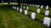 FILE - Headstones are seen at the cemetery of the U.S. Army's Carlisle Barracks, Friday, June 10, 2022, in Carlisle, Pa. The remains of nine more Native American children who died at a government-run boarding school were disinterred and returned to families, authorities said. 