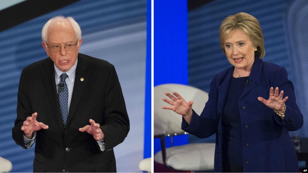 Democratic presidential candidate Senator Bernie Sanders, left, and former Secretary of State Hillary Clinton participate in town hall event in Derry, New Hampshire, Feb. 3, 2016.