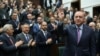 Turkish President Tayyip Erdogan greets members of his ruling AK Party during a meeting at the Parliament in Ankara, Turkey, Feb. 19, 2020. 