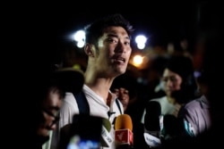 Thai prominent opposition figure Thanathorn Juangroongruangkit addresses the media as he attends a pro-democracy rally in Bangkok on Sept. 19, 2020.