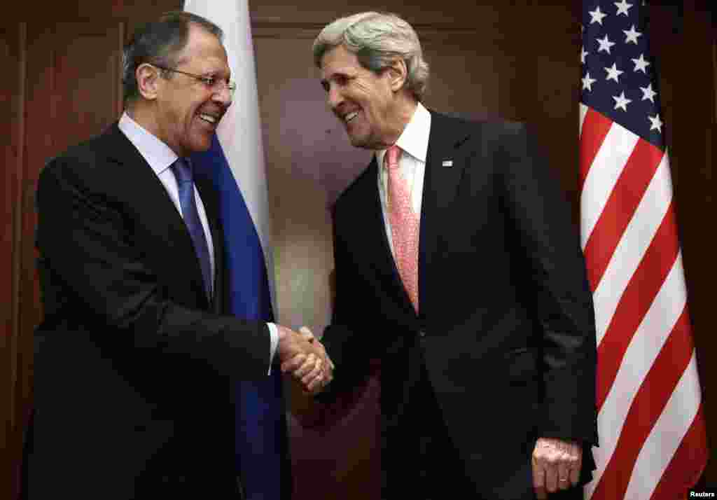 U.S. Secretary of State John Kerry (R) shakes hands with Russian Foreign Minister Sergey Lavrov at the start of their meeting in Berlin, February 26, 2013. 