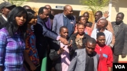 Sikhala and some of the MDC supporters outside the Bikita Magistrates Court ...