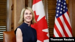 FILE - Kelly Craft, then the U.S. ambassador to Canada, is pictured at a meeting in Ottawa with Canadian Prime Minister Justin Trudeau.