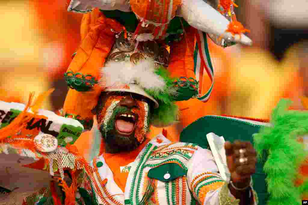 Ivory Coast fan cheers before the African Cup of Nations group D soccer match between Morocco and Ivory Coast in Al Salam Stadium in Cairo, Egypt.