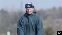 Jockey Roy Brooks goes for a morning trot on one of the race horses he rode for his return to the race track at Remington Park in Oklahoma City