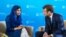 Nobel Peace Prize laureate Malala Yousafzai speaks to French President Emmanuel Macron on the sidelines of a G-7 ministers summit, in Paris, July 5, 2019.