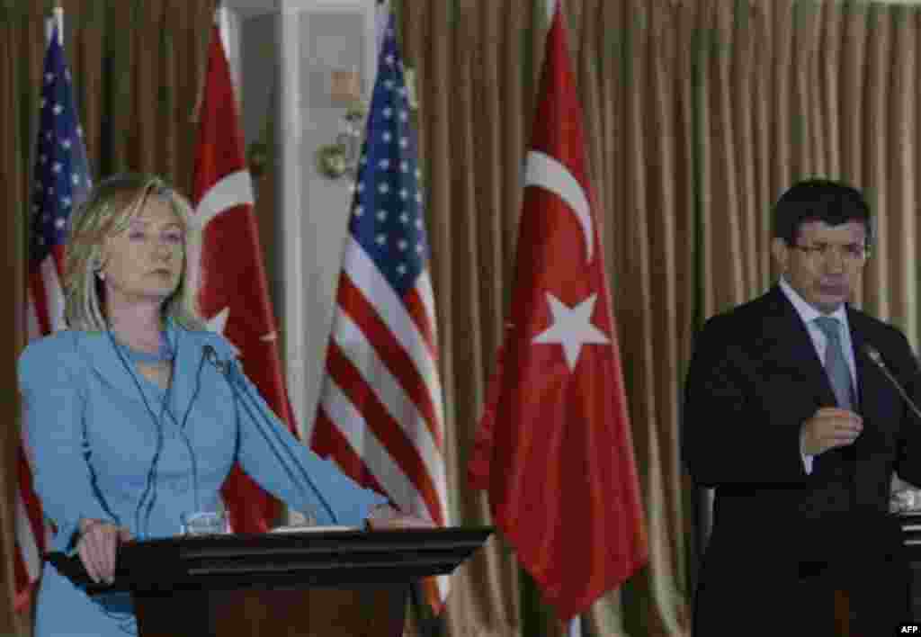 U. S. Secretary of State Hillary Rodham Clinton and her Turkish counterpart Ahmet Davutoglu speak to the media at a news conference in Istanbul, Turkey, Saturday, July 16, 2011. (AP Photo/Burhan Ozbilici)