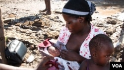 Baby Rofinho was born on the night floodwaters engulfed his family's home in Guija, southern Mozambique. His mother gave birth on the roof of her house. (Jinty Jackson for VOA)