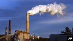 FILE - Steam billows from the coal-fired Merrimack Station in Bow, N.H., Jan. 20, 2015.