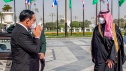 In this photo released by the Saudi Royal Palace, Saudi Crown Prince Mohammed bin Salman, right, receives Thai Prime Minister Prayuth Chan-ocha, at the royal palace in Riyadh, Saudi Arabia, Tuesday, Jan. 25, 2022. Thailand's prime minister arrived in Saudi Arabia on Tuesday for t