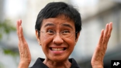 FILE - Rappler CEO and Executive Editor Maria Ressa reacts during an interview in Taguig city, Philippines, Oct. 9, 2021.