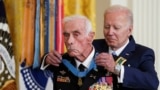 U.S. President Joe Biden awards the Medal of Honor to U.S. Army veteran Maj. John Duffy, in the East Room at the White House in Washington, U.S., July 5, 2022. 