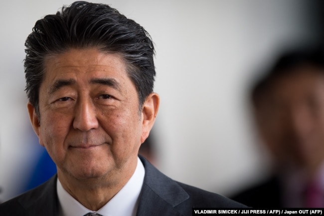 In this file photo taken on April 25, 2019 Japan's Prime Minister Shinzo Abe leaves the Bratislava Castle after a Visegrad group countries (V4) and Japan meeting in Bratislava. (Photo by VLADIMIR SIMICEK / JIJI PRESS / AFP)