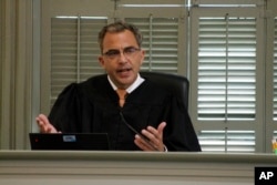 North Carolina Superior Court Judge Allen Baddour speaks to an audience inside an historic courtroom in Hillsborough, N.C., Friday, June 17, 2022.
