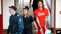 WNBA star and two-time Olympic gold medalist Brittney Griner is escorted to a courtroom for a hearing, in Khimki just outside Moscow, Russia, July 7, 2022. 