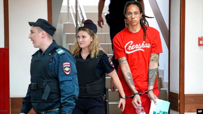WNBA star and two-time Olympic gold medalist Brittney Griner is escorted to a courtroom for a hearing, in Khimki just outside Moscow, Russia, July 7, 2022.