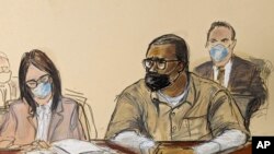 In this courtroom sketch, R. Kelly and his attorney Jennifer Bonjean appear during his sentencing hearing in federal court, June 29, 2022, in New York. The former R&B superstar, convicted of racketeering and other crimes, was given a 30-year sentence.