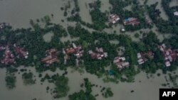 ভারী বৃষ্টির কারণে গোয়াইনঘাটের প্লাবিত একটি এলাকা এই ছবিতে দেখা যাচ্ছে। (ছবি-এএফপি )