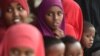 Somali refugees sit with their families, who have volunteered to be repatriated back to Somalia from the Dadaab refugee camp in northern Kenya, on Dec. 19, 2017.