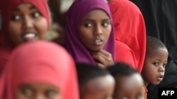 Somali refugees sit with their families, who have volunteered to be repatriated back to Somalia from the Dadaab refugee camp in northern Kenya, on Dec. 19, 2017.