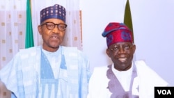 Tinubu tare da shugaba Buhari hagu