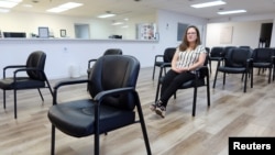 Andrea Gallegos, executive director of the Tulsa Women's Clinic, sits in an empty waiting room that was once crowded inside the clinic, in Tulsa, Oklahoma, June 20, 2022.