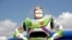 FILE - Character Buzz Lightyear stands near the entrance to the Aliens Swirling Saucers ride at Toy Story Land in Disney's Hollywood Studios at Walt Disney World in Lake Buena Vista, Fla., June 23, 2018.
