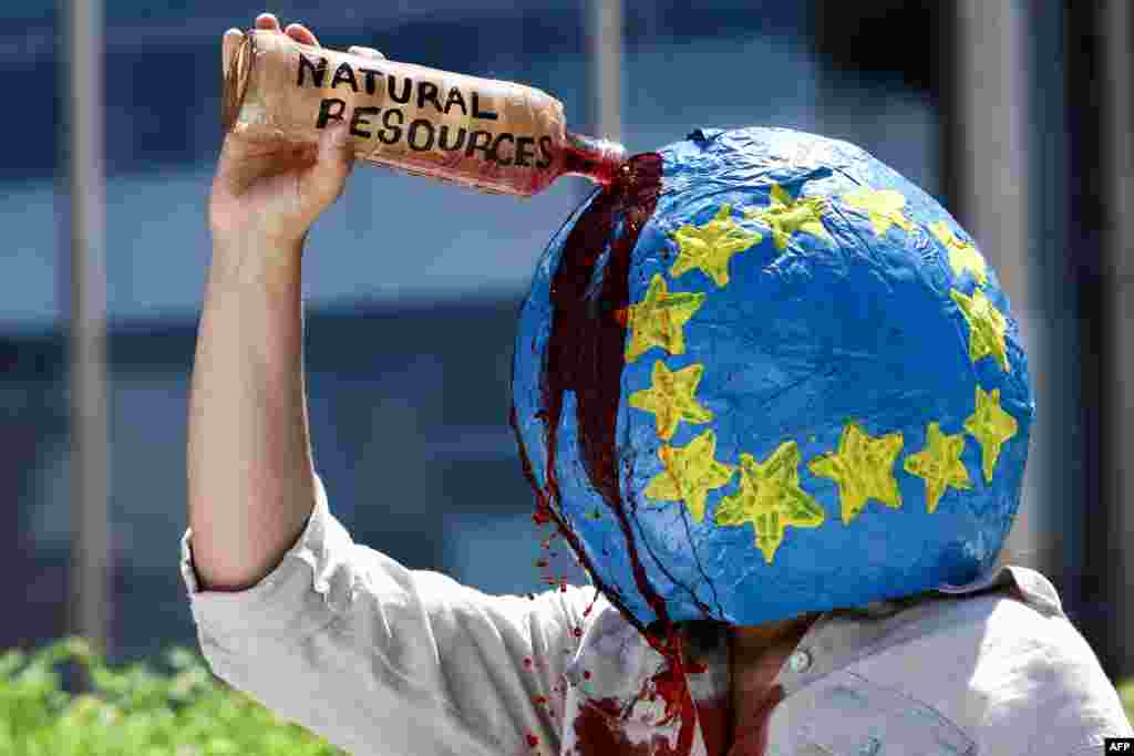An activist from the climate change protest group Extinction Rebellion takes part in a demonstration to draw attention to missing UK journalist Dom Phillips and Brazilian Indigenous affairs specialist Bruno Pereira, near the European Commission building&nbsp;in Brussels.