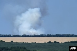 Smoke billowing after shelling, on the outskirts of the city of Sloviansk, eastern Ukraine, July 7, 2022.