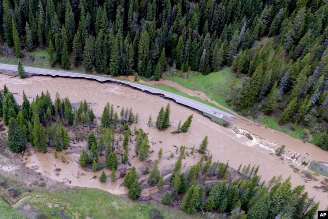 This aerial photo provided by the National Park Service shows a flooded out North Entrance Road, of Yellowstone National Park in Gardiner, Mont., on June 13, 2022. (Jacob W. Frank/National Park Service via AP)