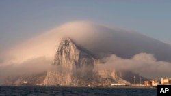 FILE: Clouds form over Gibraltar, seen from from La Linea de la Concepcion, Spain. Taken 8.18.2013