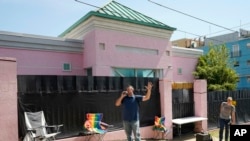 Abortion opponents stand outside the Jackson Women's Health Organization clinic and call out to the patients inside, encouraging them to not have an abortion, Jackson, Miss., June 25, 2022.