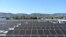 Solar panels are seen on the roof of a building in Los Angeles, California, on June 18 2022.