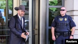 Couy Griffin, founder of the "Cowboys for Trump" organization and a commissioner of Otero County, New Mexico, leaves federal court in Washington, June 17, 2022. Griffin was sentenced for breaching the U.S. Capitol during the January 6, 2021, riot. 