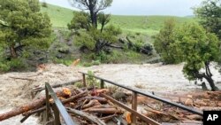In this photo provided by the National Park Service, is a washed out bridge from flooding at Rescue Creek in Yellowstone National Park, Mont., on June 13, 2022. 