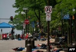 Chairs and belongings are seen left behind at the scene of a mass shooting at a Fourth of July Parade in downtown Highland Park, Illinois, July 5, 2022.