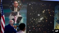 President Joe Biden listens during a briefing from NASA officials about the first images from the Webb Space Telescope, the highest-resolution images of the infrared universe ever captured, in the South Court Auditorium on the White House complex, July 11, 2022.