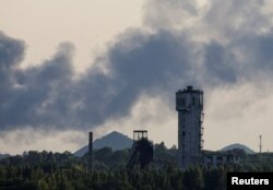 Smoke rises after shelling during the Ukraine-Russia conflict in Donetsk, Ukraine, July 6, 2022.