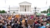 Protesters gather outside the Supreme Court in Washington, June 24, 2022. The Supreme Court has ended constitutional protections for abortion that had been in place nearly 50 years, a decision by its conservative majority to overturn the court's landmark 