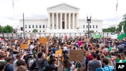Protesters gather outside the Supreme Court in Washington, June 24, 2022. The Supreme Court has ended constitutional protections for abortion that had been in place nearly 50 years, a decision by its conservative majority to overturn the court's landmark 