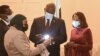 File- Lucara Diamond Botswana managing director Naseem Lahri (2nd L) shows Botswana President Mokgweetsi Masisi (2nd R) and First Lady Neo J Masisi a 1,174-carat diamond in Gaborone, Botswana, on July 7, 2021, that the Lucara Botswana found in June 2021. 